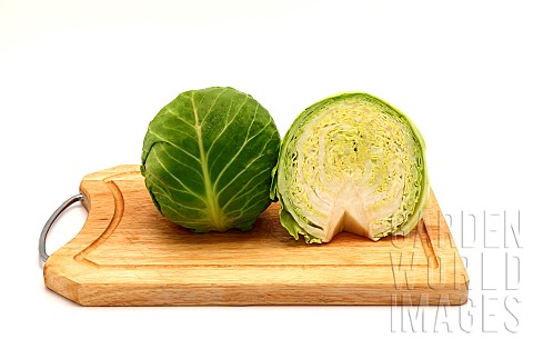 Sliced_head_of_cabbage_on_a_cutting_board_on_a_light_background_Natural_product_Natural_color_Closeu