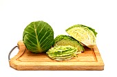 Sliced head of cabbage on a cutting board on a light background. Natural product. Natural color. Close-up.