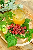 Infusion with Raspberry leaves (Rubus idaeus) and freshly picked Raspberries, health benefits: vitamins C, B, zinc, iron, phosphorus, magnesium, potassium