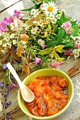 Mirabelle plums, yellow plums, mirabelle plum jam in the kitchen, fruit in a bowl and a bunch of flowers