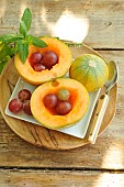 Melon for dessert, served with grapes and fresh mint