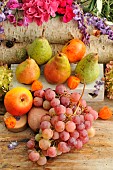 Autumn fruits: pears, grapes, walnuts, hazelnuts, gooseberries, apples, seasonal treasures at the end of summer and beginning of autumn