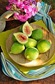 White figs (Ficus carica) in a wooden plate