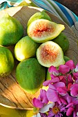 White figs (Ficus carica) in a wooden plate