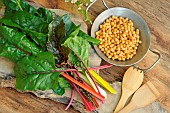 Chard, Beta vulgaris, different varieties, Chickpea, wooden spoon