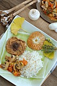 Mushroom season in the kitchen, Parasol Mushroom (Macrolepiota procera) and Button mushrooms (Agaricus bisporus) cooked with tomatoes