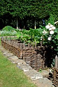 Vegetable plant and flowers in raised plessis squares, Medieval Garden of Bois Richeux, Eure et Loir, France