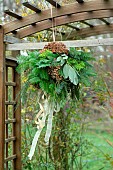 Christmas decoration, floral arrangement with branches of Fir, Eucalyptus, Cypress Cupressus and wilted Hydrangea flowers.