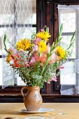 Cut flowers in an old farmhouse, Ecomusée de Haute Alsace, Haut-Rhin, Alsace, France