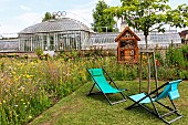 Insect hotel in the Bonnétable vegetable garden. Magnificent glass greenhouse from the 19th century, where several varieties of tomato are grown. The Bonnétable vegetable garden is the work of the Buhler brothers, two landscape designers who also created the Le Thabor garden in Nantes. Sarthe, France