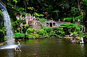 The main lake and waterfall of the Monte Palace tropical garden. Funchal. Madeira island. Portugal.