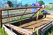 Gardener in front of his glass frame, Sarthe, France