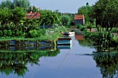 Boats and vegetable garden, Marsh of Bourges, Cher, France