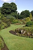 Rock garden border by lawn