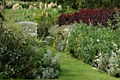 Bench and garden path at Inverlesk Garden in Scotland