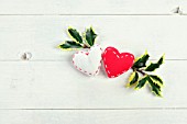 RED AND WHITE FABRIC HEARTS WITH HOLLY