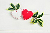 RED AND WHITE FABRIC HEARTS WITH HOLLY