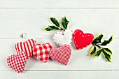 RED AND WHITE FABRIC HEARTS WITH HOLLY