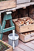 POTS AND WOODEN CRATES IN A POTTING SHED