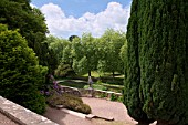 FORMAL TERRACES WITH JUNIPERUS AND TAXUS TREES. AT ST FAGANS CASTLE GARDENS