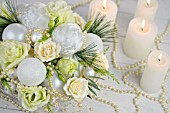 FLOWER ARRANGEMENT WITH WHITE ROSES, EUSTOMIA, LYSIANTHUS, CANDLES AND PEARLS