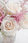 PASTEL COLOURED ARRANGEMENT WITH ROSES, ASTILBE AND GRASSES