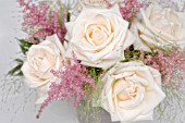 PASTEL COLOURED ARRANGEMENT WITH ROSES, ASTILBE AND GRASSES