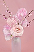 PINK EDGED RANUNCULUS AND SWEAT PEAS IN BOTTLE