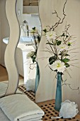 FLOWER ARRANGEMENT WITH WHITE DAHLIAS IN BATHROOM