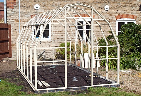 GREENHOUSE_CONSTRUCTION_AT_WAKEFIELDS_GARDEN_MAIN_STRUCTURE_PART_COMPLETED_NOT_GLAZED
