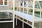 GREENHOUSE CONSTRUCTION AT WAKEFIELDS GARDEN, FINISHED BUILDING SHOWING STAGING.