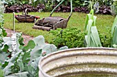 MOCKED UP KITCHEN GARDEN AT CHELSEA, WITH OLD TOOLS