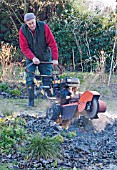 NIGEL COLBORN OPERATING A STUMP GRINDER