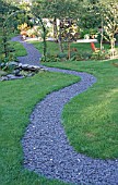 PATHWAY LEADING TO SEATING AREA IN SEWELL GARDEN,  WALES.