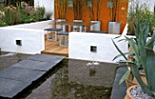 MODERN PATIO AND POOL  URBAN CALM DESIGN P WYNNIATT HUSEY AND P CLARKE HAMPTON COURT