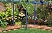 BLUE PERGOLA IN A SMALL GARDEN