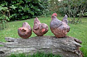 CERAMIC CHICKENS ON A LOG