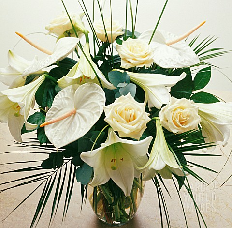 WHITE_FLOWERS_AND_GREEN_FOLIAGE_FLOWER_ARRANGEMENT