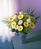 YELLOW AND GREEN FLOWERS IN VASE, INDOOR