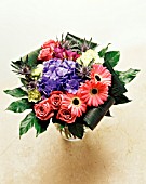 RED, YELLOW AND PURPLE FLOWERS WITH GREEN FOLIAGE FLOWER ARRANGEMENT