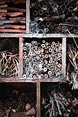 Garden, Insect hotel and bug refuge made from roof tiles, plant cones and  wood.