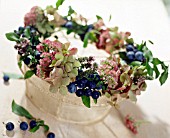 WREATH MADE OF AUTUMNAL BLOSSOMS AND BERRIES