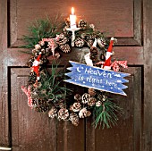 WREATH DECORATED WITH FIR CONES