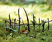 TINY FENCE MADE OF BRANCHES AND TWIGS
