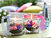 JAM JARS WITH CANDLES AND FLOATING BLOSSOM