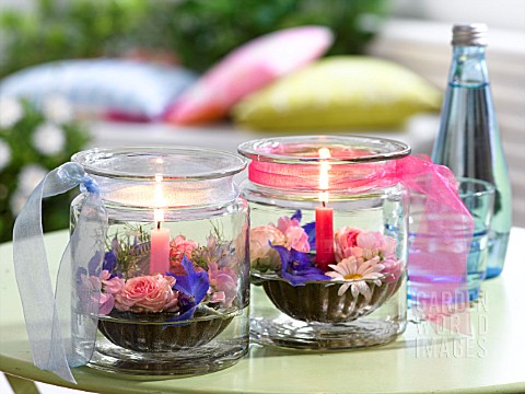 JAM_JARS_WITH_CANDLES_AND_FLOATING_BLOSSOM