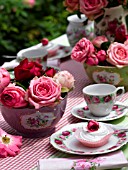 PLACE SETTING AND MERINGUE WITH ROSES