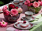 PLACE SETTING AND MERINGUE WITH ROSES