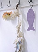 FISH ON HOOKS ON A SHELF