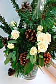 WINTRY BOUQUET: FIR BRANCHES, ROSES, FIR CONES